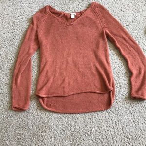 Burnt orange sweater.